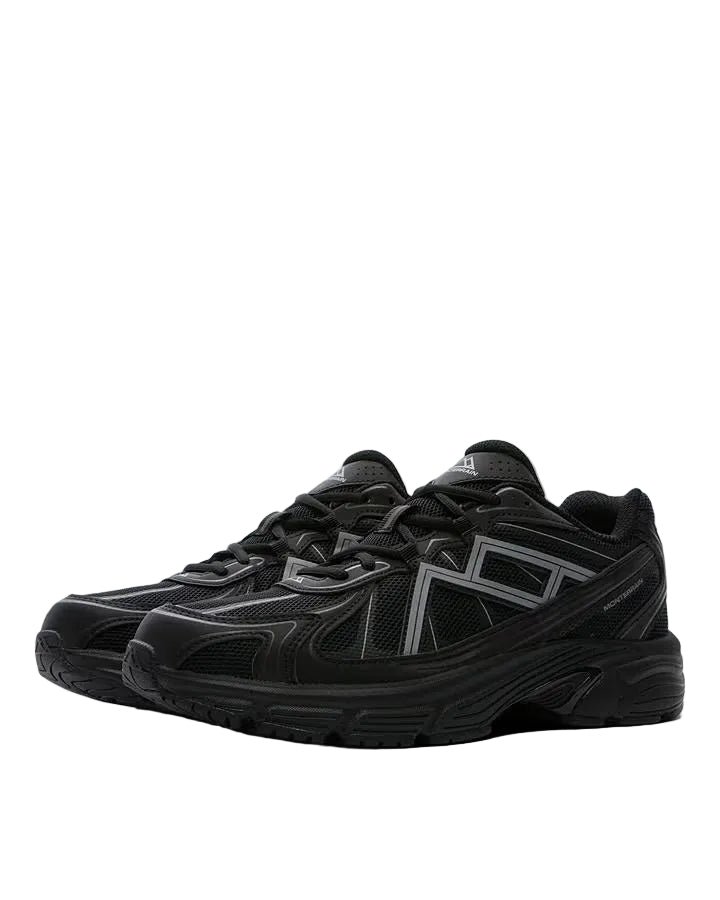 A pair of black athletic sneakers with dark gray geometric side stripes, shown from a three-quarters angle against a solid light gray background.